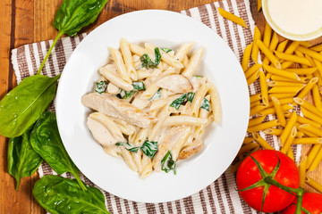 Chicken Alfredo Pasta with Spinach. Selective focus.