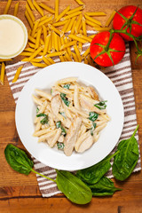 Chicken Alfredo Pasta with Spinach. Selective focus.