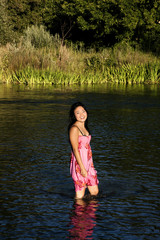 Young Japanese Woman Standing In River Smiling Wet Dress