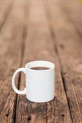 White coffee mug on a wooden table