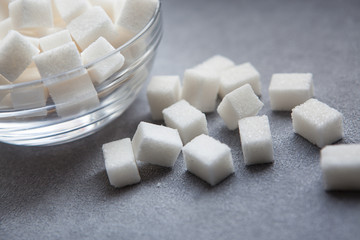 Sugar cubes on gray background