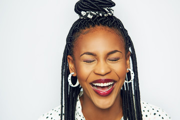 Laughing elegant black woman with eyes closed