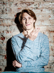 Young attractive guy posing in studio