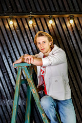 Young attractive guy posing in studio