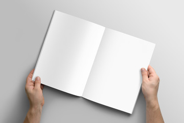 Blank A4 photorealistic brochure mockup on light grey background. 