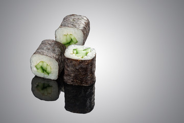 Sushi rolls on black background