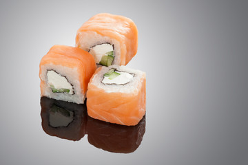 Sushi rolls on black background
