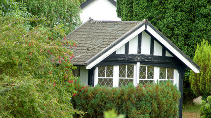 Little black and white garden summer house