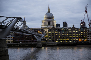 Fototapeta na wymiar Millennium bridge and St Paul Cathedral at evening