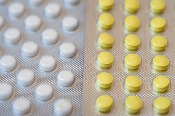 Yellow pills in a blister pack closeup