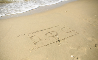 Soccer court drawn on the sand beach