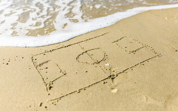 Soccer court drawn on the sand beach