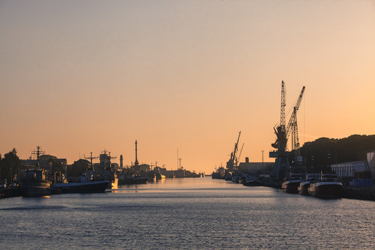 LIEPAJA, LATVIA - JUNE 19, 2017: Sunset at the seaport. Trading channel. Port of Liepaja, Latvia