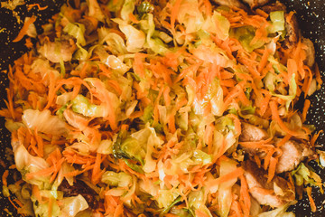 Food ingridients: meat, onion, ginger for recipe stewed beans with meat frying in a pen on a stove. Steps in cooking, process of preparing food. Concept of homemade healthy food.