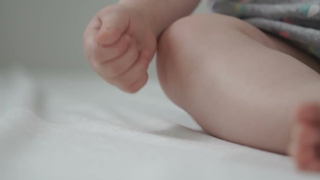 Hand of a nursing baby