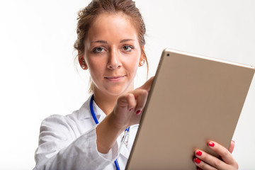 Young woman doctor using a tablet pc