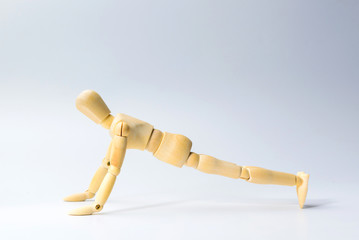 Wooden figure doll with push up for health on white  for exercise training and helth concept