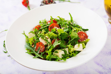 Vitamin Salad of fresh tomatoes, herbs, feta cheese and flax seeds. Dietary menu. Proper nutrition.