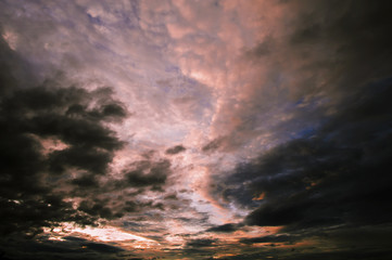 Fototapeta premium The sky is covered with black clouds at twilight