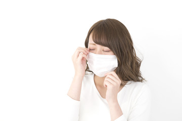 マスクの女性　眼が痒い　花粉症　風邪　汎用