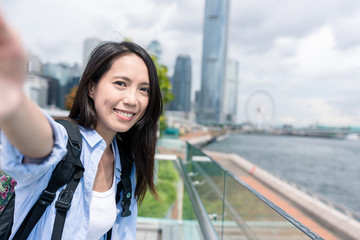 Woman taking selfie in Hong Kong