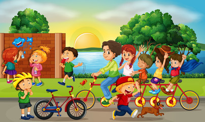 Obraz na płótnie Canvas Road scene with kids and family riding bikes