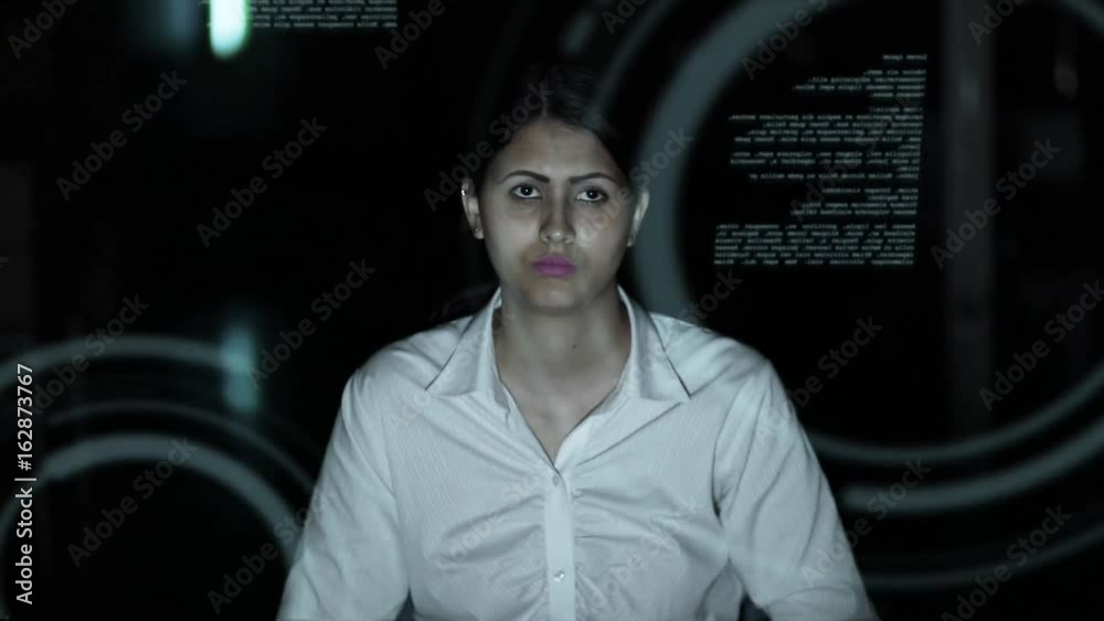 Poster businesswoman looking at futuristic interface. IoT(Internet of Things). ICT(Information Communication Technology). GUI(Graphical User Interface). HUD(Heads up Display).