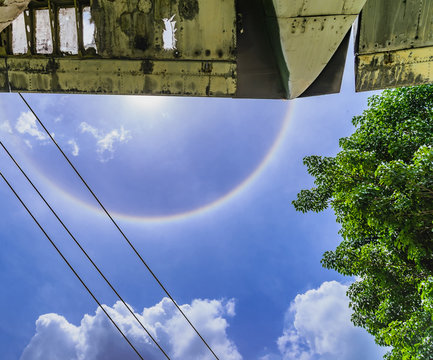 Sun halo with cloud in the blue sky.