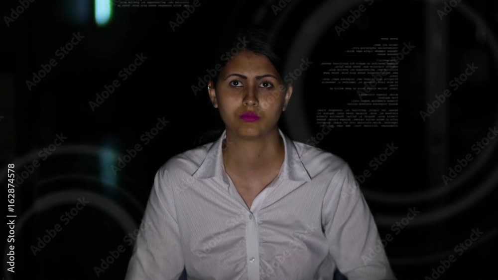 Poster businesswoman looking at futuristic interface. IoT(Internet of Things). ICT(Information Communication Technology). GUI(Graphical User Interface). HUD(Heads up Display).
