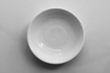white ceramic bowl on white background, top view