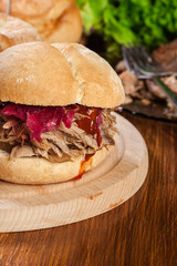 Pulled pork sandwich with red cabbage and bbq sauce