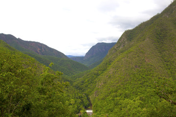 Fototapeta na wymiar Mountain green valley stream landscape.