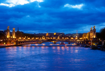 Fototapeta na wymiar Alexandre III Bridge at blue night , Paris, France, retro toned