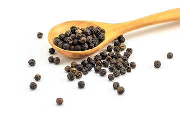 Peppercorn with wooden spoon on white background. Composition isolated over the white background.