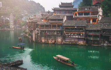 Old houses in Fenghuang county on Oct 22, 2013 in Hunan, China. The ancient town of Fenghuang was...
