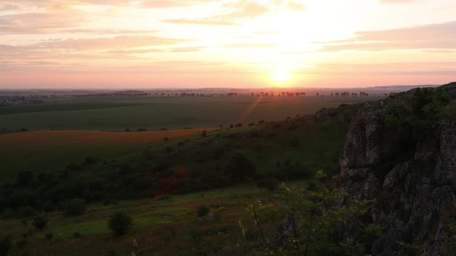 Sonset on the green field. Timelapse