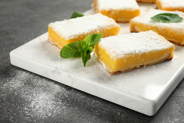 Delicious lemon pie bars on cutting board
