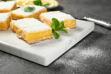 Delicious lemon pie bars on cutting board