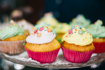 Homemade Sweets Muffins in Sweets Shop Closeup Background