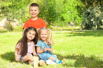 Naklejka na ściany i meble Cute little children in park on sunny day