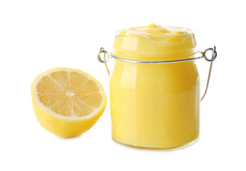 Glass jar with yummy lemon curd on white background