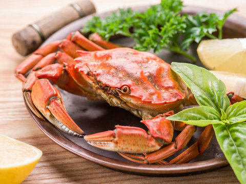Cooked crab with lemon and herbs.
