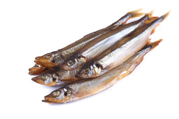 smoked capelin fish on a white background  (isolated). Close up