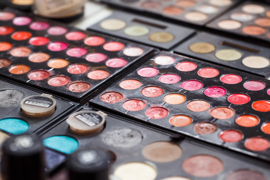 Used Cosmetics pallets close-up on the table