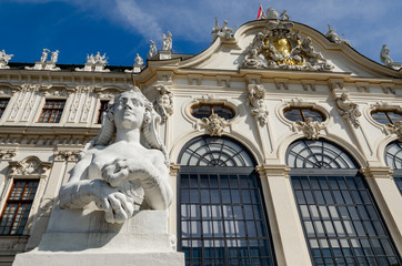 Upper Belvedere Castle (Schloos Belvedere) in Vienna, Austria. Detail of the facade and of the sphinx sculpture seen from the public park around the palace