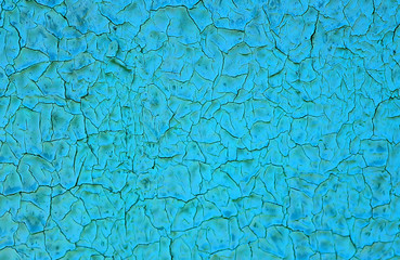 Blue cracked painting on the wall. Background
