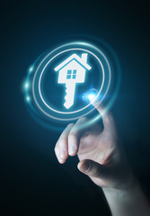 Businesswoman touching 3D rendering icon house with her finger