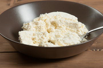 Homemade Cottage Cheese In Bowl. Soft Cheese.