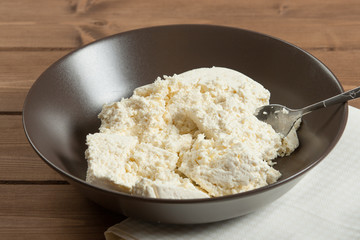 Homemade Cottage Cheese In Bowl. Soft Cheese.