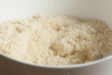 Crumbs. Cooking Process Of Homebaked Cottage Cheese Pie. Raw Ingredients In Bowl.